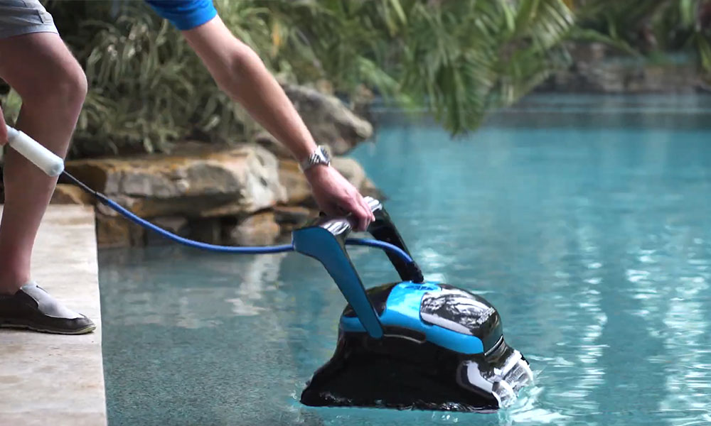 Dolphin Nautilus CC Supreme Robotic Pool Cleaner into pool